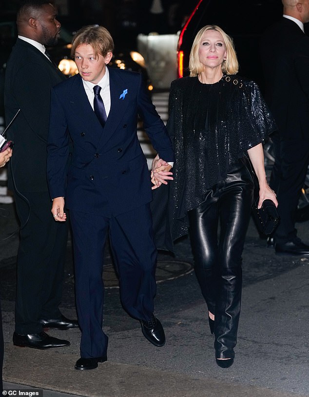 Dashiell looked dapper in a navy blue suit and matching tie