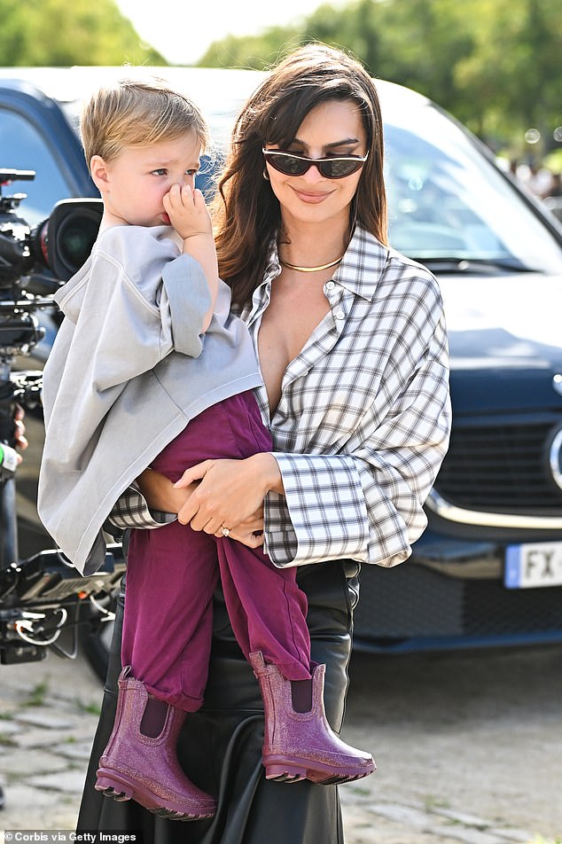 Her three-year-old son made a splash in a pair of purple cords and stylish matching boots