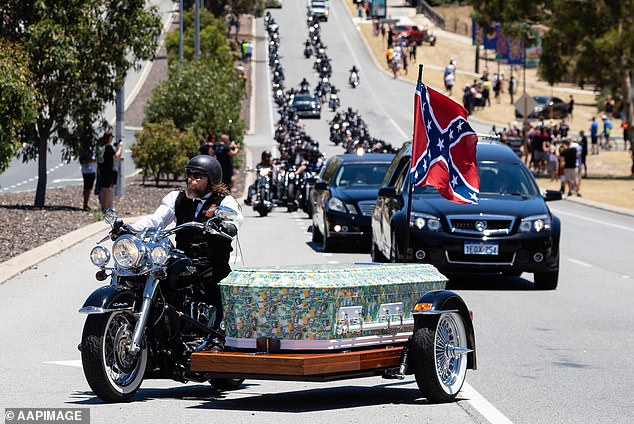 Rebel biker Nick Martin was driven to Pinnaroo Cemetery in a coffin covered in photos of $100 bills (pictured) during his extravagant motorcycle funeral on December 23, 2020