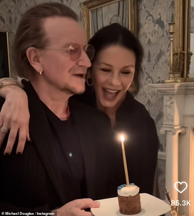 The actress shouted out Happy Birthday with the U2 frontman holding a candlelit cake