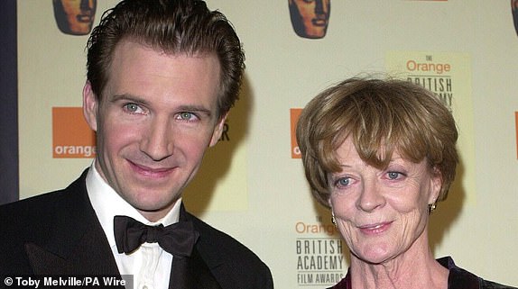 File photo dated 04-09-2000 of Dame Maggie Smith and Ralph Fiennes presenting actress Maggie Smith with a BAFTA Award for Best Supporting Actress for the film "Tea With Mussolini" at the Orange British Film Awards (BAFTAS) at the Odeon Leicester Square, London. Dame Maggie Smith died in hospital on Friday, her sons Chris Larkin and Toby Stephens said in a statement. Date of issue: Friday, September 27, 2024. PA Photo. See PA story DEATH Smith. Photo credit should read: Toby Melville/PA Wire