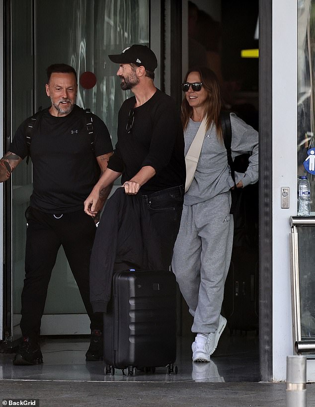 Mel and Chris arrived in Ibiza on the morning of the gig and both looked cheerful at the airport