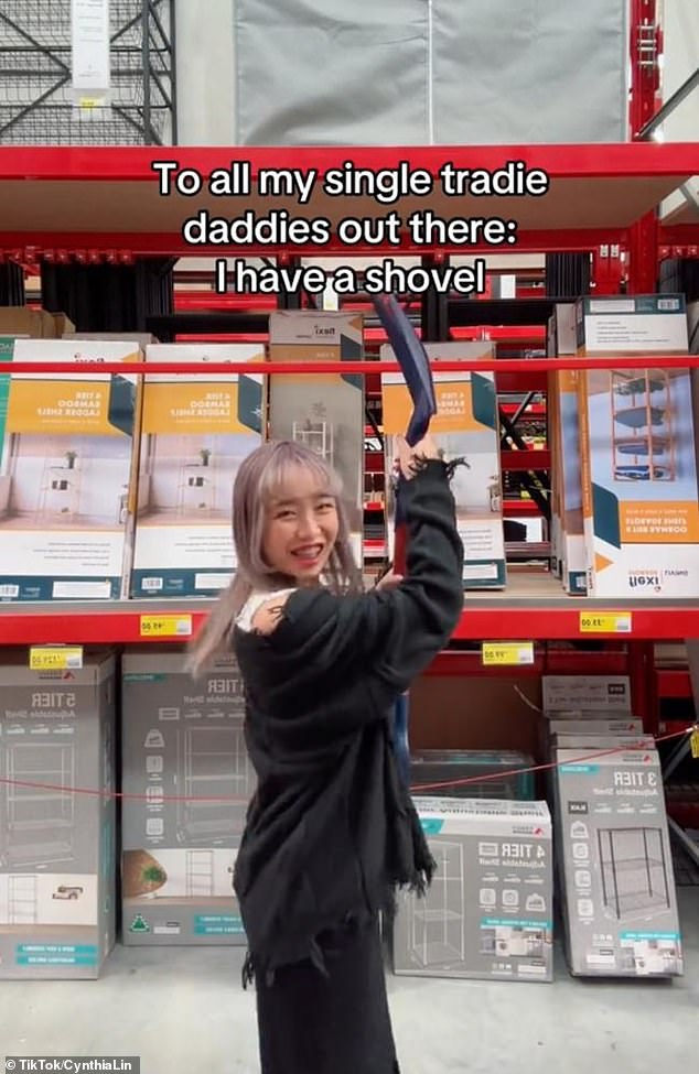 The content creator uploaded a video of herself holding a shovel in a Bunnings store (pictured)