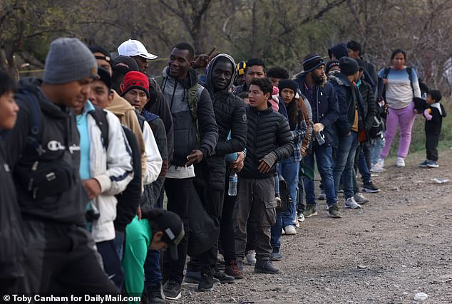 Migrants who have entered Arizona illegally are waiting in line awaiting processing by Border Patrol