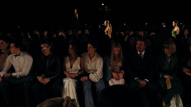 The Beckham family later gave a show of unity as they sat together in the front row next to Vogue's Anna Wintour