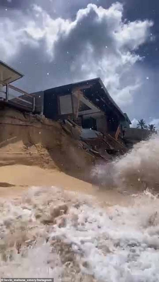 As the structure crumbled, Instagram user kevin_makana_emery, who captured the video, can be seen warning onlookers: “Be careful where you stand. The whole roof is coming down now.' The video shows glass, metal and wood crashing into the ocean