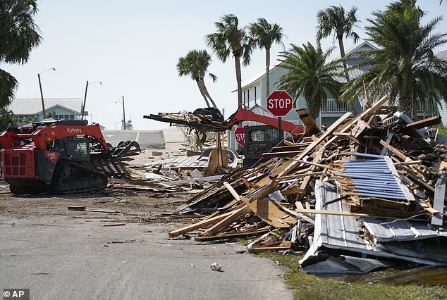 The storm made landfall on Thursday, bringing a storm surge that reportedly hit the small island in the Gulf of Mexico by five feet. Workers were busy digging through the rubble on Friday