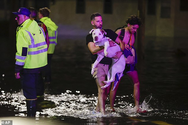 Residents are seen here being rescued from the water in the aftermath of Hurricane Helene in Crystal River, Florida, on Friday