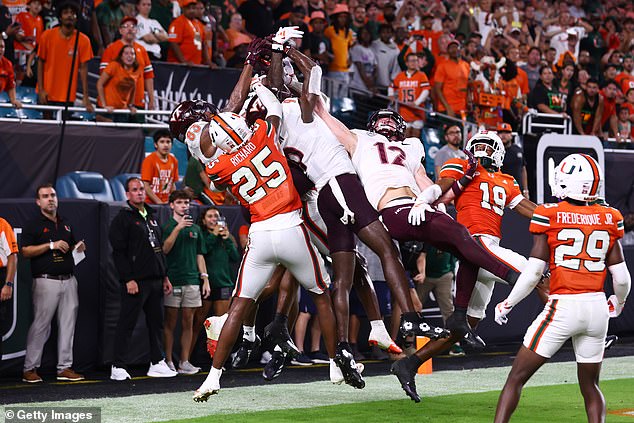 Miami Hurricanes defenders break up a pass intended for Da'Quan Felton