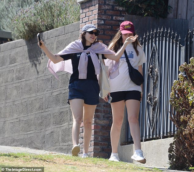 She was seen chatting animatedly with a friend during the outing