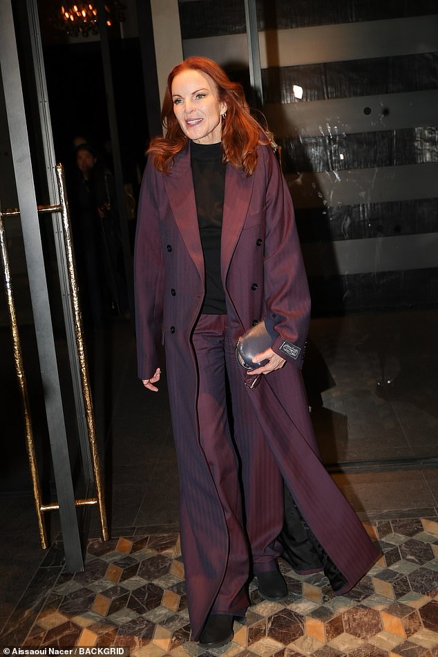 American actress Marcia Cross turns heads in a striking plum suit at the Vetements party at Costes in Paris