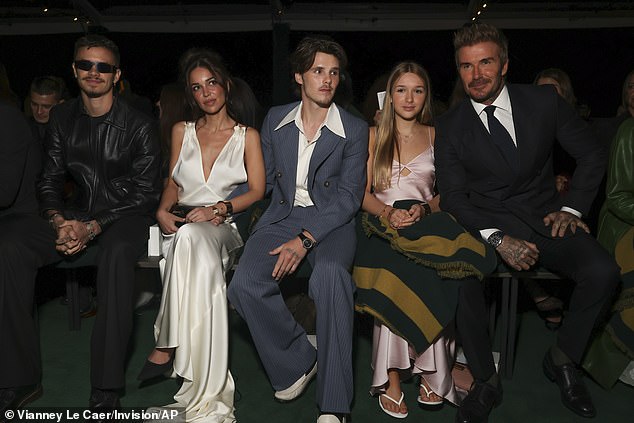 Victoria's famous family beamed with happiness as they sat in the audience next to Vogue's Anna Wintour for the showcase of her Spring/Summer 2025 collection