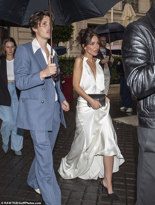 Aspiring singer Cruz put on a dapper appearance for the event, wearing a sky blue pinstripe suit paired with dress white shoes as he arrived with his girlfriend Jackie Apostel