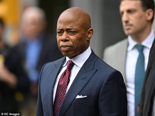 Hours earlier before the visit, Adams is seen leaving Manhattan Federal Court after pleading not guilty