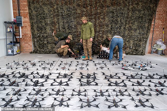 Armed Forces soldiers inspect the FPV drones during the handover by the volunteer organization on September 13, 2024 in Lviv, Ukraine