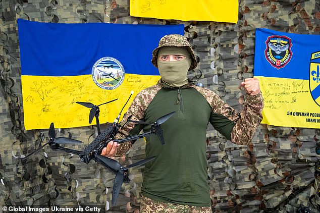 A soldier of the Armed Forces of Ukraine holds an FPV drone during a transfer of a volunteer organization on September 13, 2024