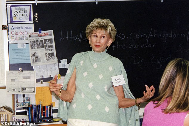 Dr. Eger gives a presentation to a classroom full of students in the 1980s