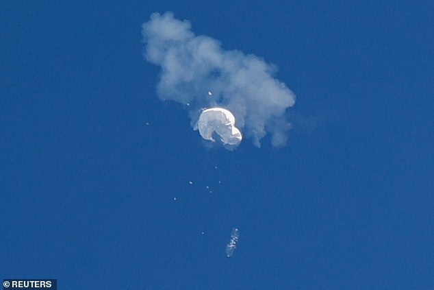 Suspected Chinese spy balloon floats towards the ocean after being shot down off the coast in Surfside Beach, South Carolina on February 4, 2023