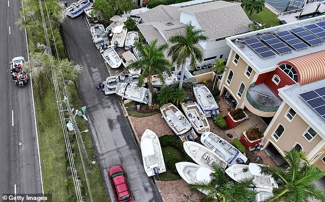 Dozens of boats washed up on the streets of Treasure Island, Florida