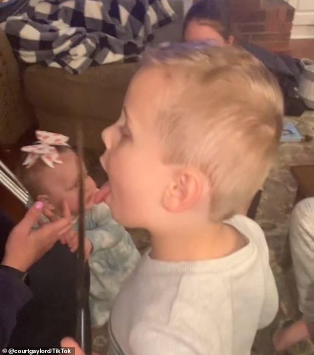 Elliett's cousin Brody, then three years old, stole the spotlight when he stepped into the video frame licking the icing off a giant sharp knife