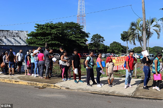 Migrants wait in line to resolve their status in the city of Tapachula, Mexico, September 23, 2024. Mexico's southern border is experiencing a new wave of migration as a month has passed since the new US rule allowing an asylum appointment through the 'CBP One '. 'application to be processed from the Mexican border with Central America