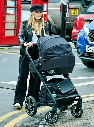 Joanne pushes her newborn's £750 pram safely onto the pavement