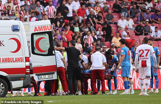 After being treated by medical staff, he was taken from the field to hospital by ambulance