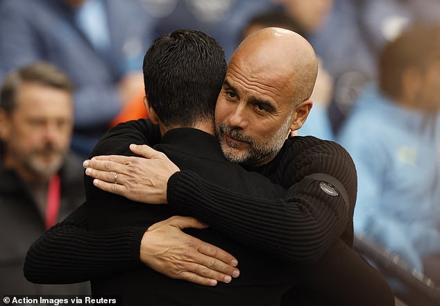 Managers Pep Guardiola (right) and Mikel Arteta hugged before last Sunday's match