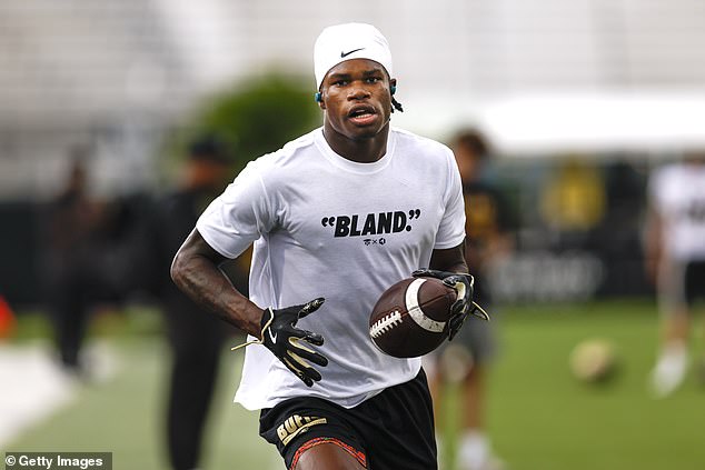 Receiver/cornerback Travis Hunter warms up before Saturday's game in Orlando