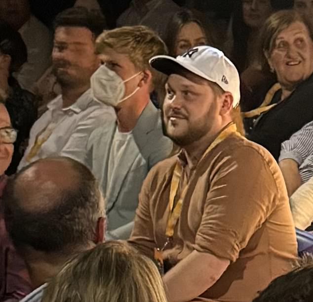 Before taking them off at the photo wall, the source also said the safety-conscious couple arrived at the crowded event wearing matching black and white face masks.