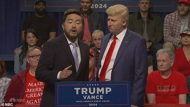 Fellow cast member Bowen Yang appeared on stage as Trump's Vice President JD Vance, as Trump staffers rolled away the bulletproof glass as he took the stage