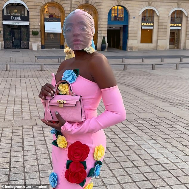 She completed the look with a pair of red lace tights and carried a pink Steve Madden clutch