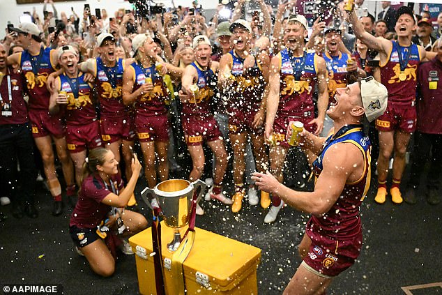 The Swans coach was forced to carry out his media duties as Lions celebrated loudly