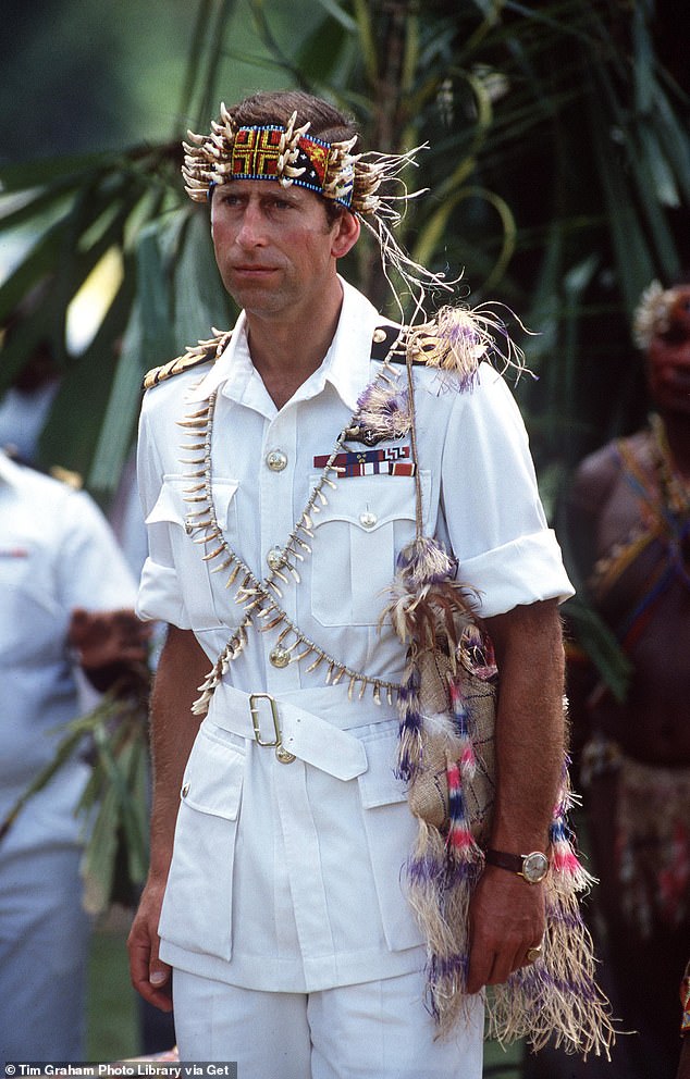 Pictured: Prince Charles during a visit to Papua New Guinea, wearing traditional costume