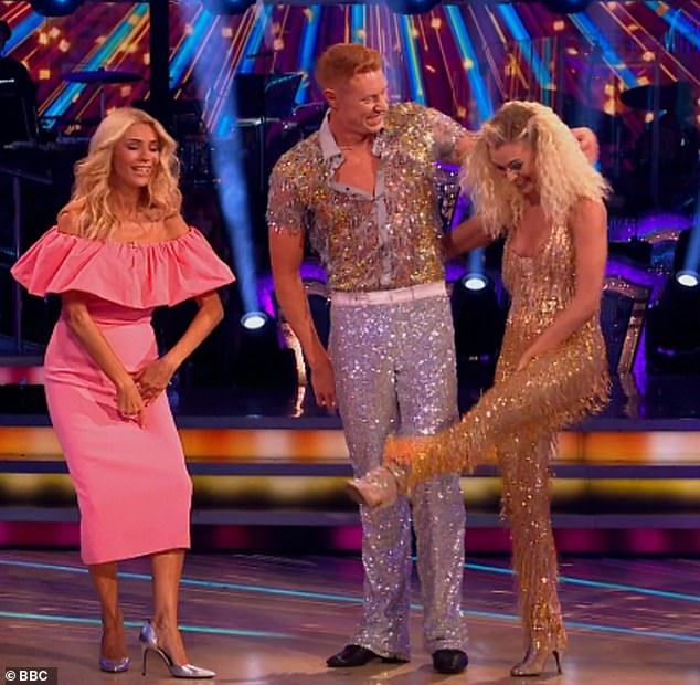 Meanwhile, Pro Nadiya Bychkova, 36, kicked off the show as she and Olympian Tom Dean, 24, strutted their stuff in sequins to a disco-inspired Cha Cha, only for her skin-tight sequined jumpsuit to rip between her legs.