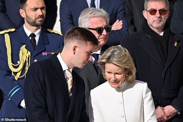 The Belgian royals were also accompanied by their eldest son, Prince Gabriel of Belgium, 21, who wore a blue overcoat along with a smart suit and gold-patterned tie.