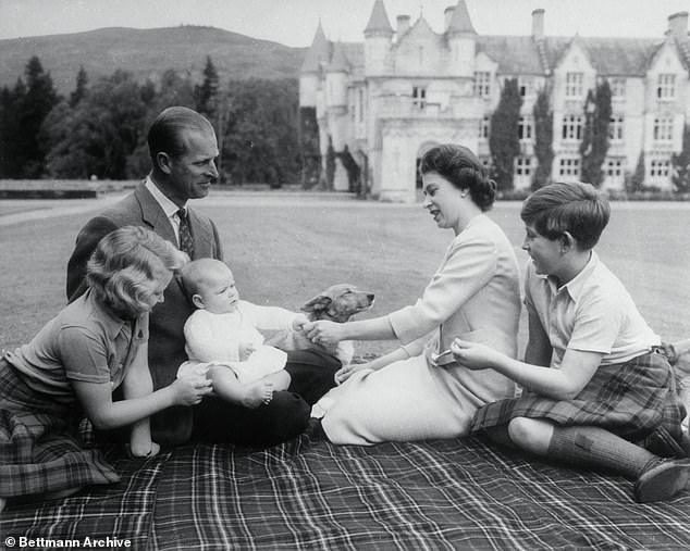 The couple the Duke of Edinburgh and Queen Elizabeth II are seen here in the grounds of Balmoral Castle with children (from left) Princess Anne, Prince Andrew and Prince Charles