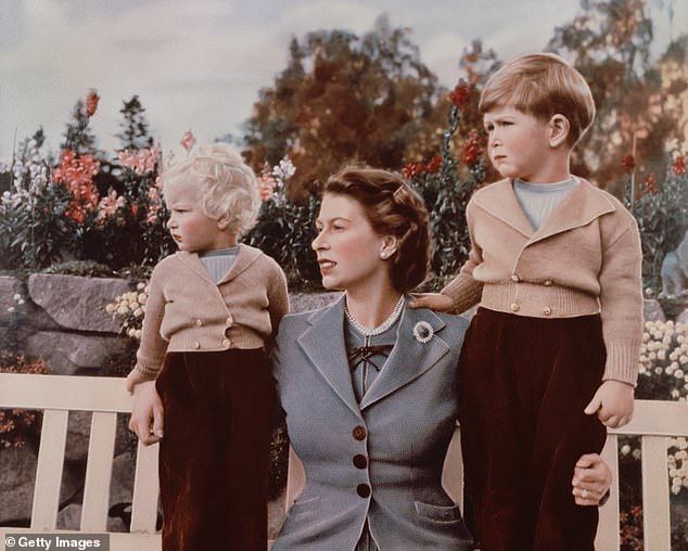 She is seen here with children Anne (left) and Charles (right) in September 1952 at Balmoral