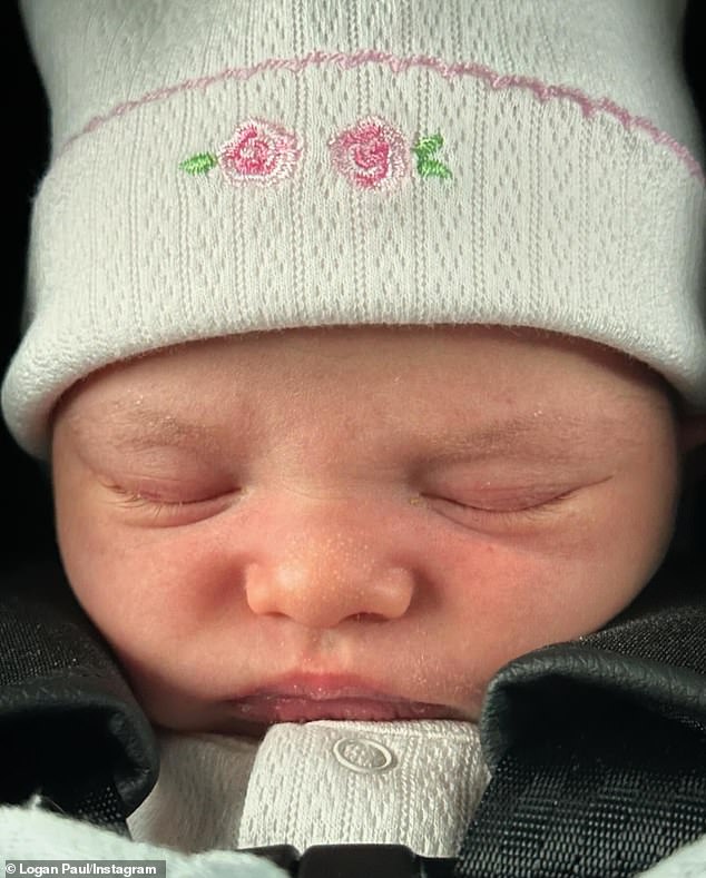 The proud new parents also shared a photo of their daughter wearing a floral print hat