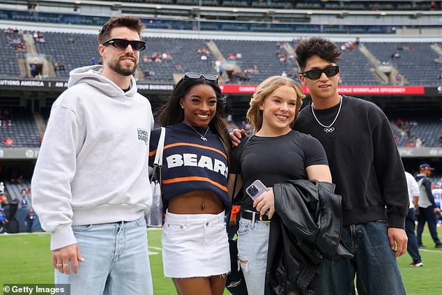 To avoid another fashion mistake, Biles wore a Bears jersey to support her husband