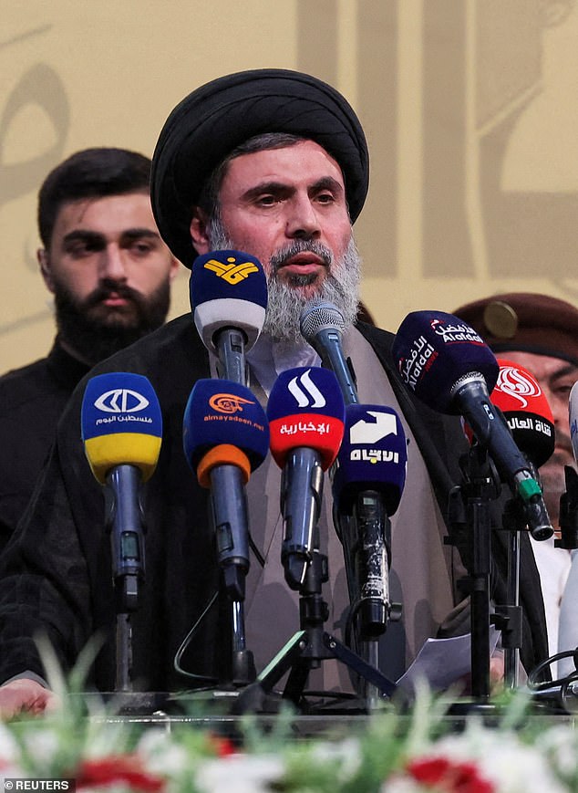 Senior Hezbollah official Hashem Safieddine speaks with Mohammed Nasser – a commander at the militant group's funeral on July 4, 2024