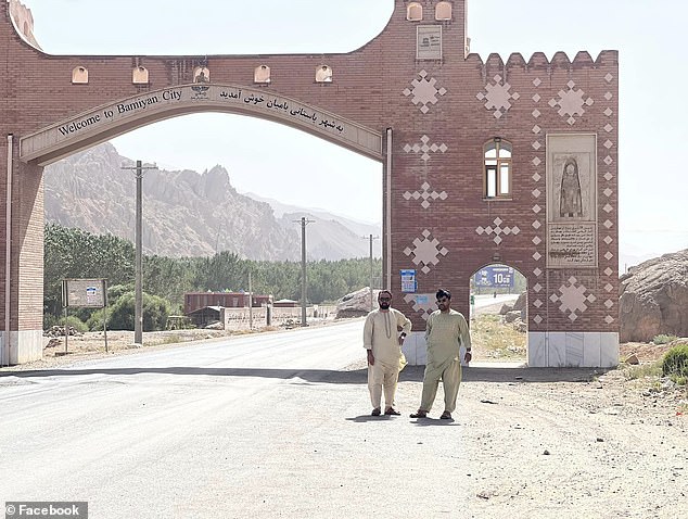 Rahimi is pictured posing outside the access road to Bamiyan City, a three-hour drive west of the capital Kabul