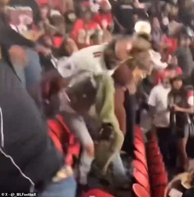 A man wearing a Falcons jersey could be seen repeatedly stomping on someone else's head in one clip