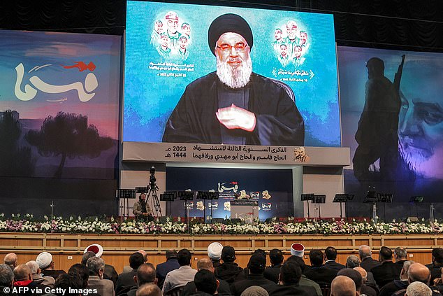 Hezbollah supporters attend a televised speech by the group's leader, Hassan Nasrallah, in the southern suburbs of the Lebanese capital Beirut on January 3, 2023.