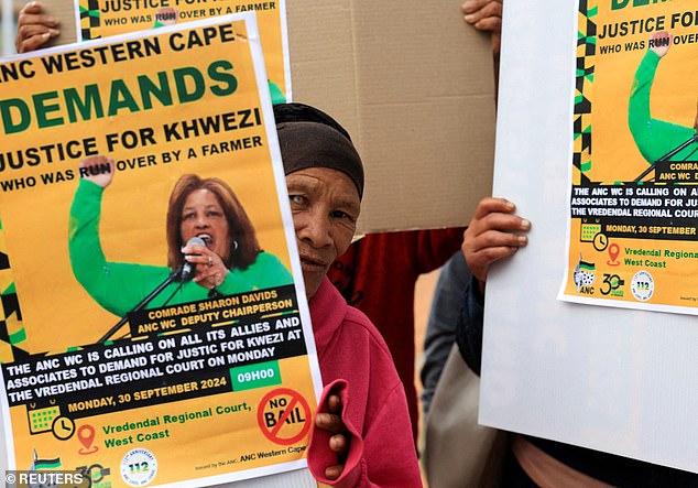 People protest outside the Vredendal court before the appearance of farmer Christoffel Stoman