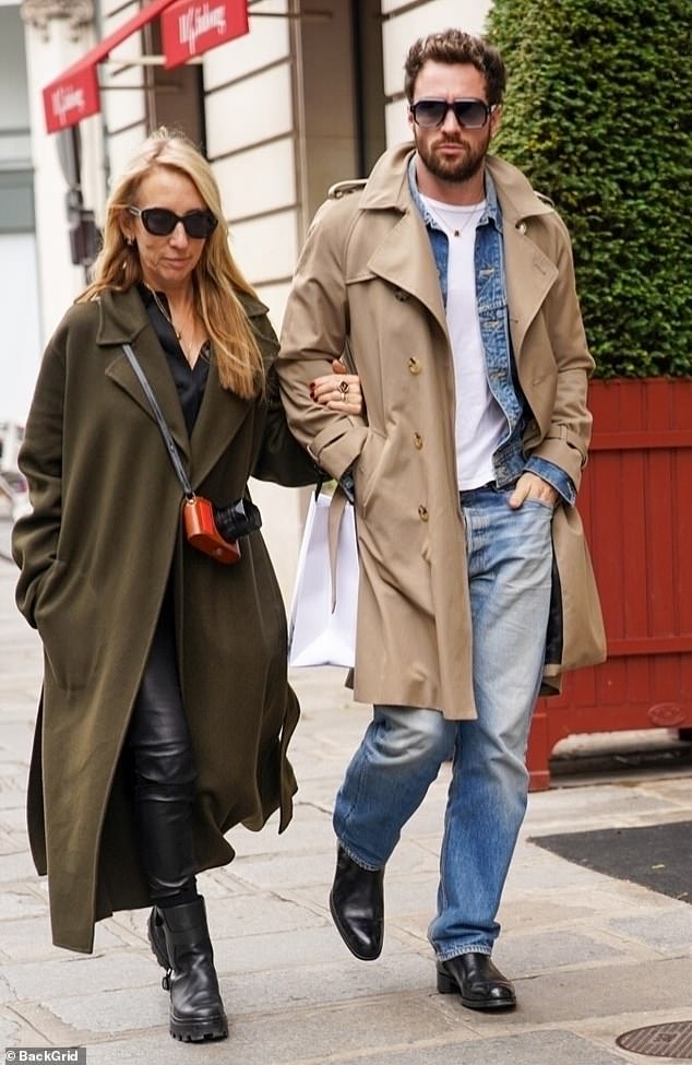 Aaron and Sam looked beyond in love as they took a brisk walk around the French city amid their busy schedules