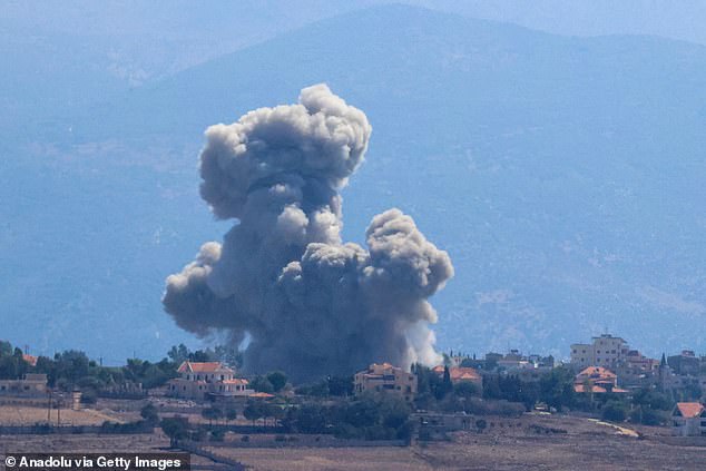 Smoke rises from the area as a result of the Israeli army's attacks on the town of Hiyam today