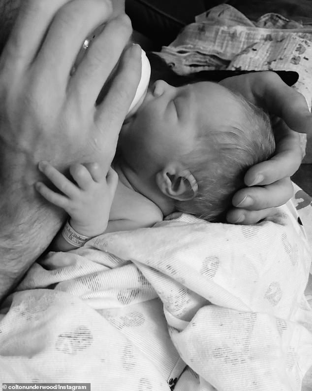 The sweet snaps showed their child being cared for with a bottle of milk