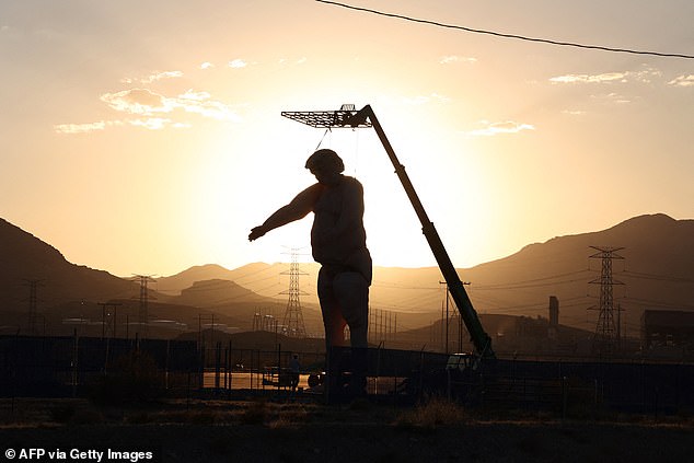 The statue will get some sun Saturday where the sun doesn't shine in the Nevada desert