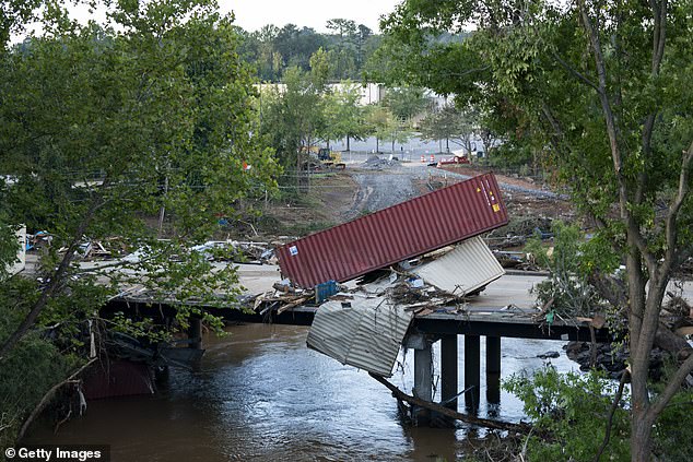 Flood damage is spread across a road in the aftermath of Hurricane Helene